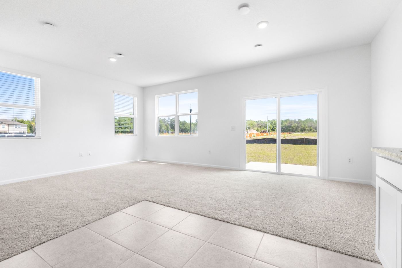 Bright open living area with sliding glass door